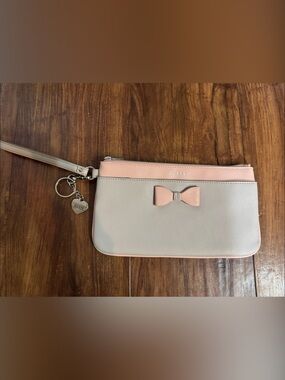 GUESS Cream and Pink Bow Accent Wristlet